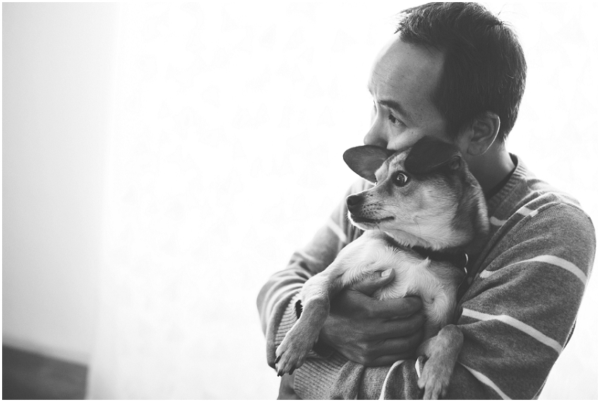 Los Angeles lifestyle photographer capturing a candid photograph of a man hugging a dog